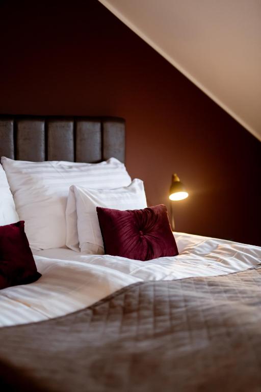 Postel nebo postele na pokoji v ubytování Home Hotel Cardinal