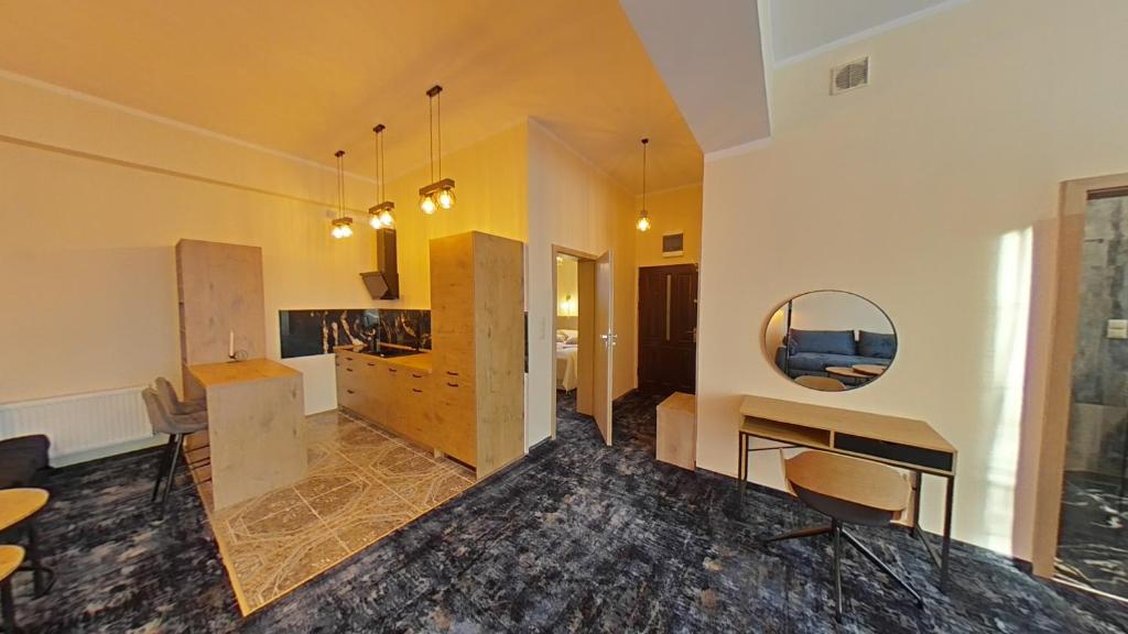 Telewizja i/lub zestaw kina domowego w obiekcie Apartament ARKA