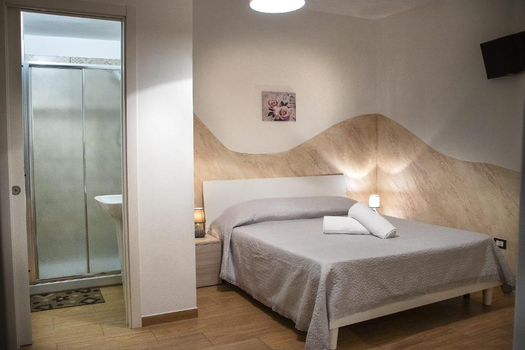 Postel nebo postele na pokoji v ubytování B&B Pastello