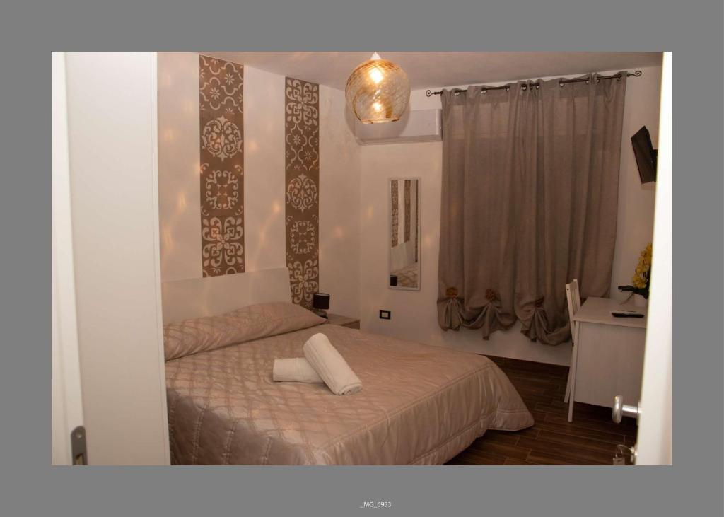 Postel nebo postele na pokoji v ubytování B&B Pastello