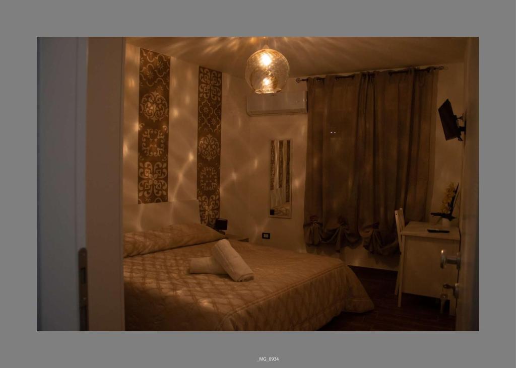Postel nebo postele na pokoji v ubytování B&B Pastello