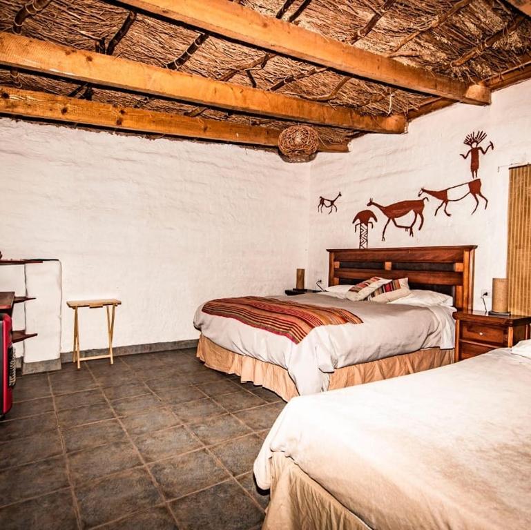 Postel nebo postele na pokoji v ubytování Incahuasi Travelodge