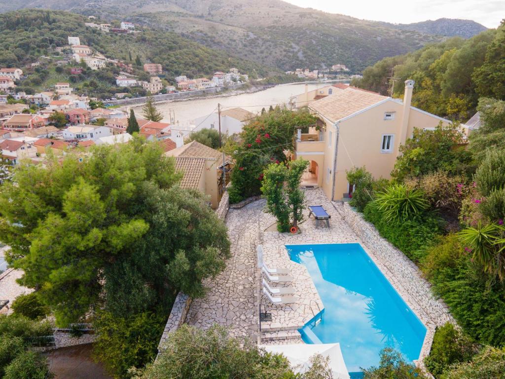 an aerial view of a villa with a swimming pool at Villa Moyria by PosarelliVillas in Kassiopi