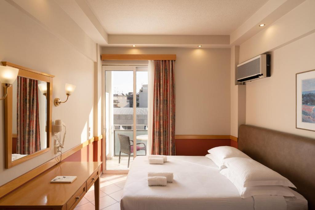 Ένα ή περισσότερα κρεβάτια σε δωμάτιο στο Hotel Ntina