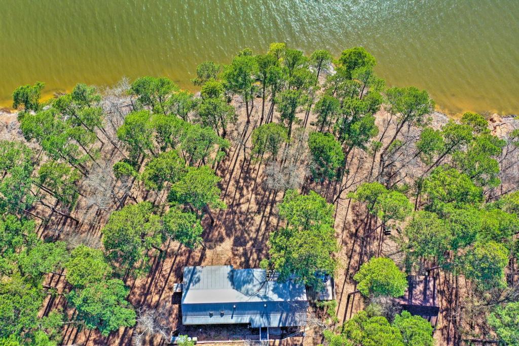 an aerial view of a house on a mountain at Secluded Avinger Home with Lake Access! in Avinger
