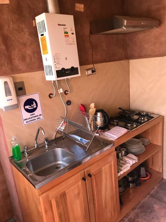 Kuchyň nebo kuchyňský kout v ubytování Incahuasi Travelodge