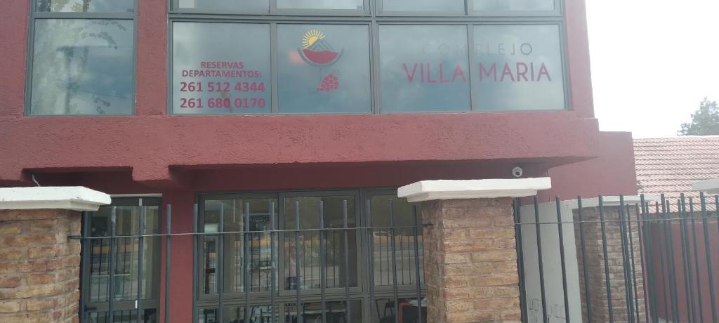 a building with a sign that reads villa marina at Complejo Villa Maria in Ciudad Lujan de Cuyo