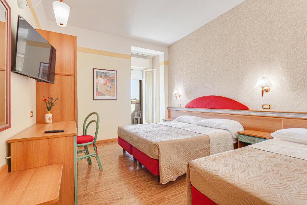 Postel nebo postele na pokoji v ubytování Hotel Fantini