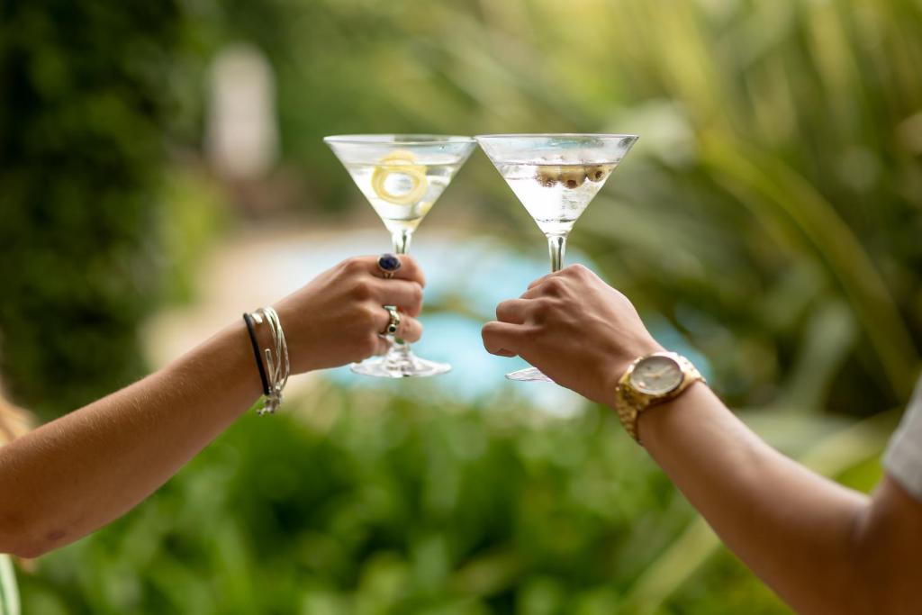 two people holding up glasses of champagne at The Royal Hotel in Ventnor