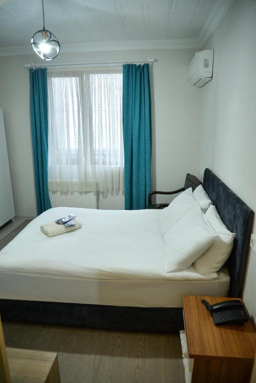 Postel nebo postele na pokoji v ubytování Elite Holiday Hotel