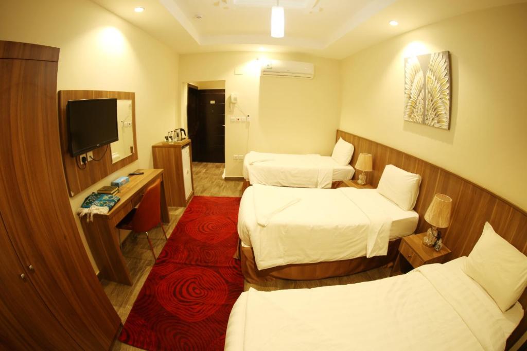 TV a/nebo společenská místnost v ubytování فندق المربع السابع Seventh Square Hotel