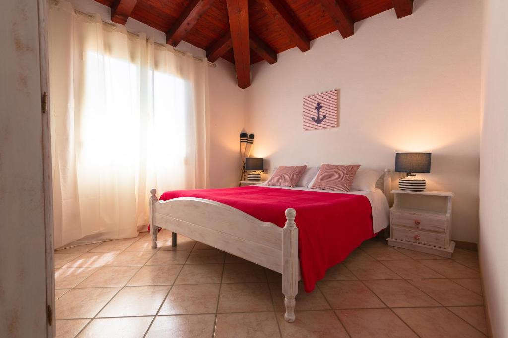 Posteľ alebo postele v izbe v ubytovaní Residence SardegnaSummer Li Cuppulati
