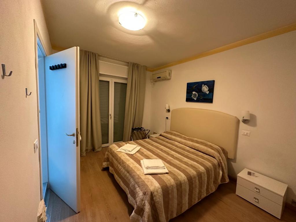 Postel nebo postele na pokoji v ubytování Hotel Irene