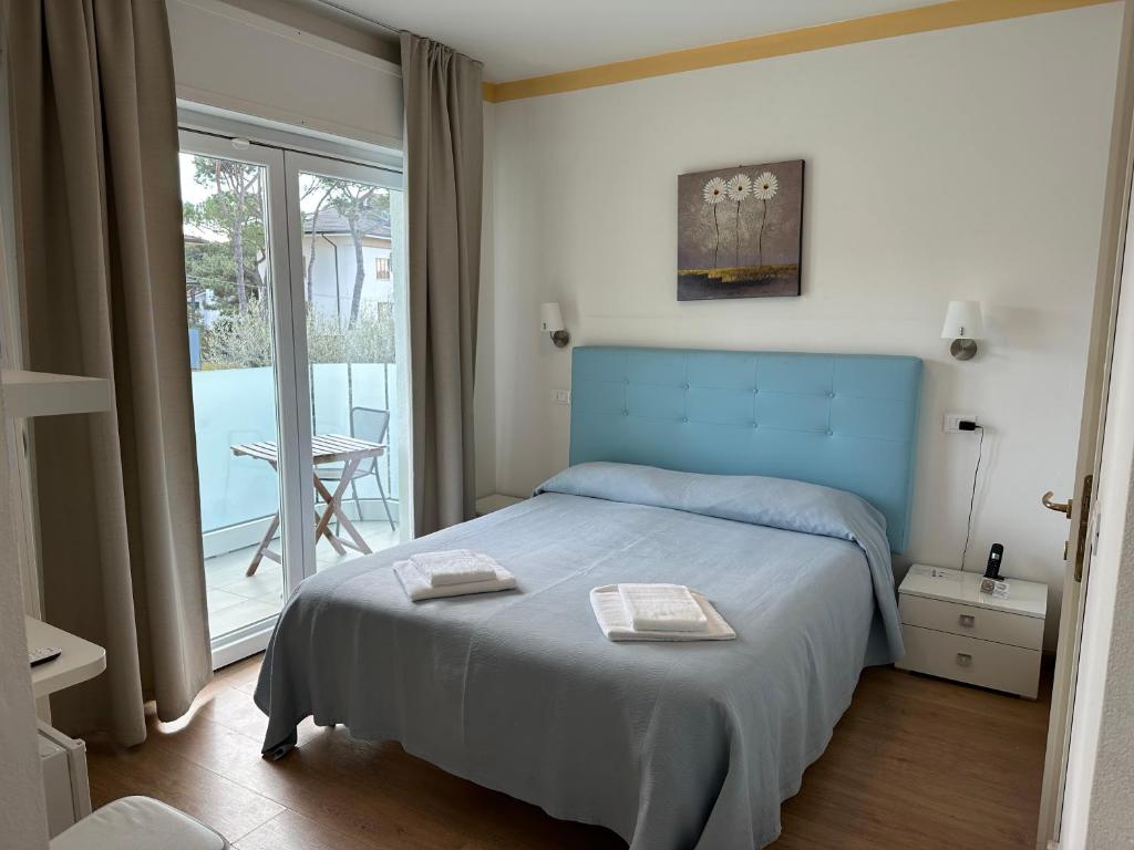Postel nebo postele na pokoji v ubytování Hotel Irene