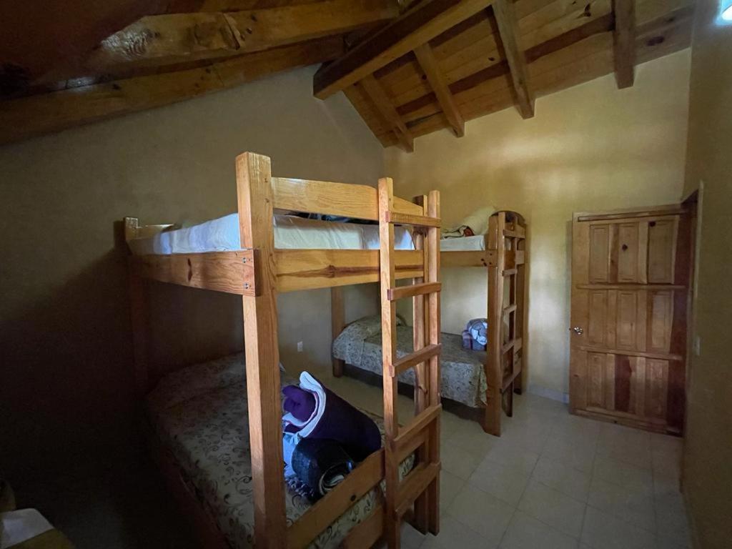Postel nebo postele na pokoji v ubytování Cabañas Lupita