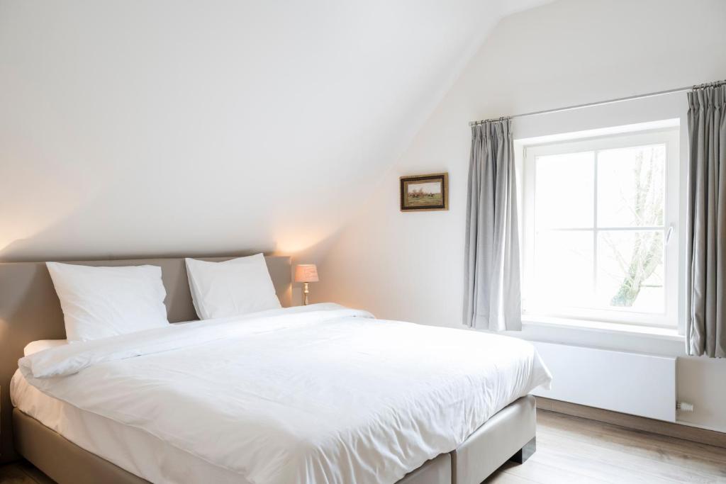 Voodi või voodid majutusasutuse Loweide Lodges & Holiday Homes near Bruges toas