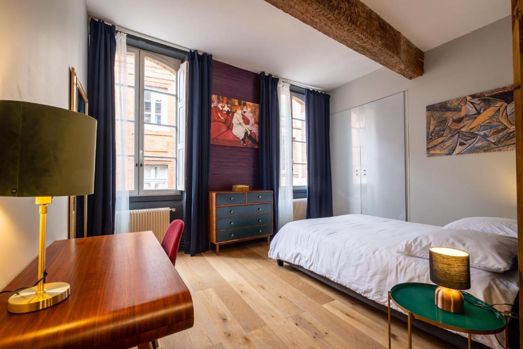 Posteľ alebo postele v izbe v ubytovaní Appartement de prestige – rue des Arts