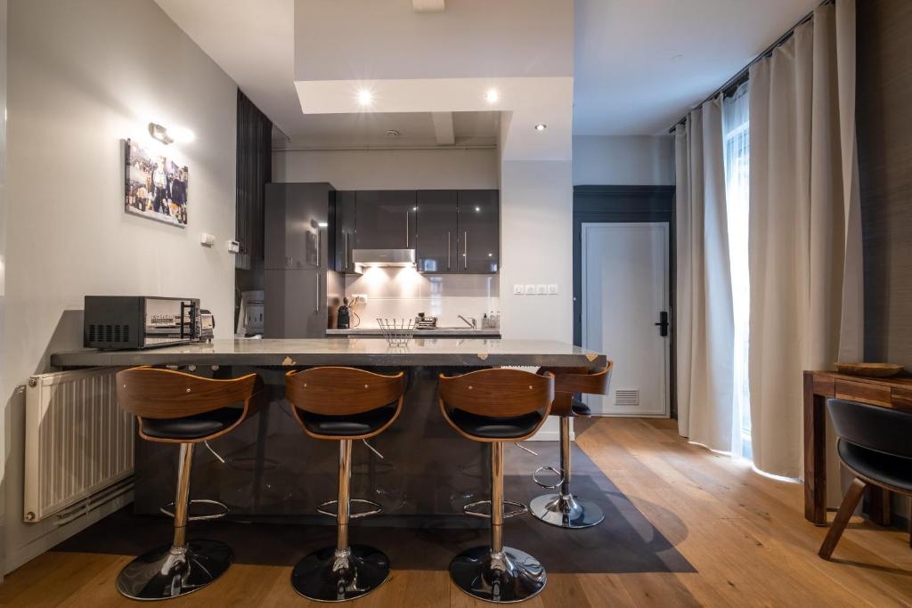 Kuchyňa alebo kuchynka v ubytovaní Appartement de prestige – rue des Arts