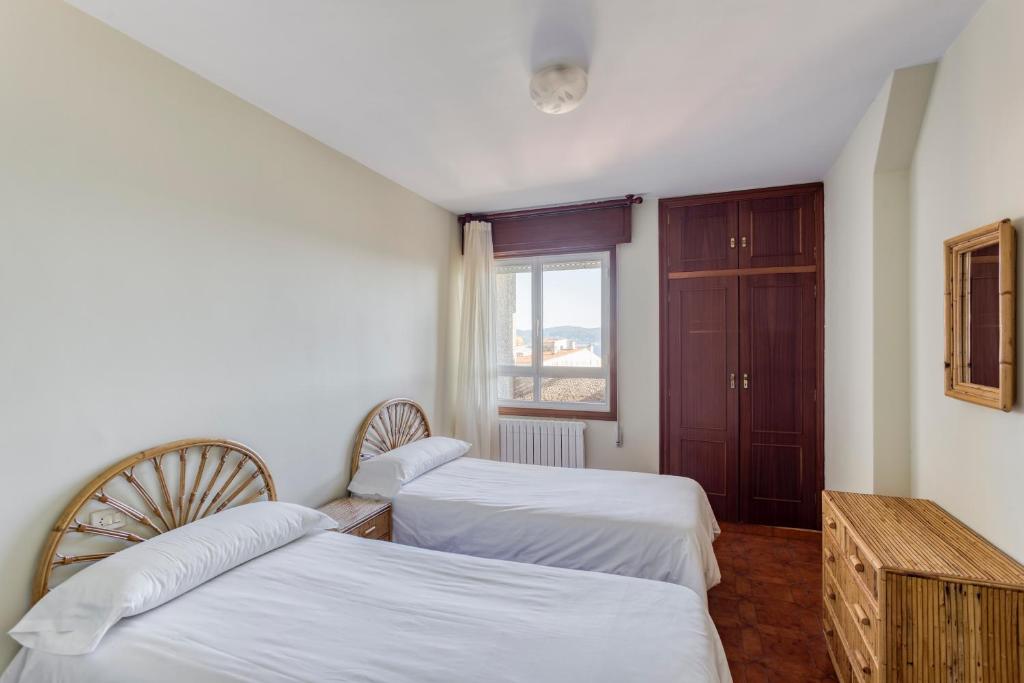 Postel nebo postele na pokoji v ubytování Apartamentos Granxola