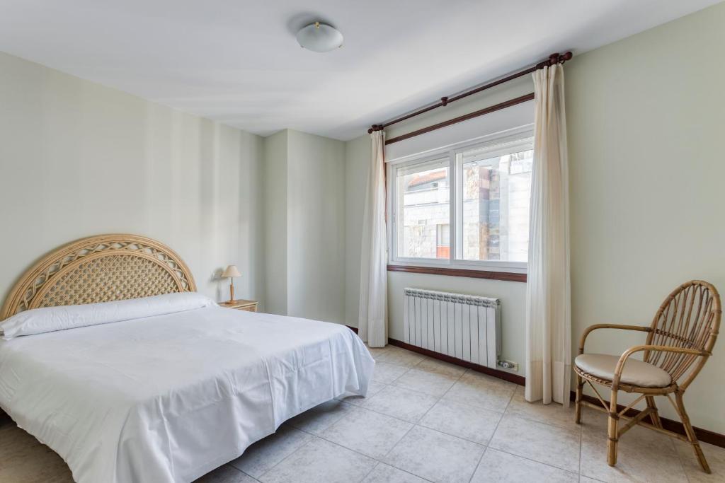 Postel nebo postele na pokoji v ubytování Apartamentos Granxola