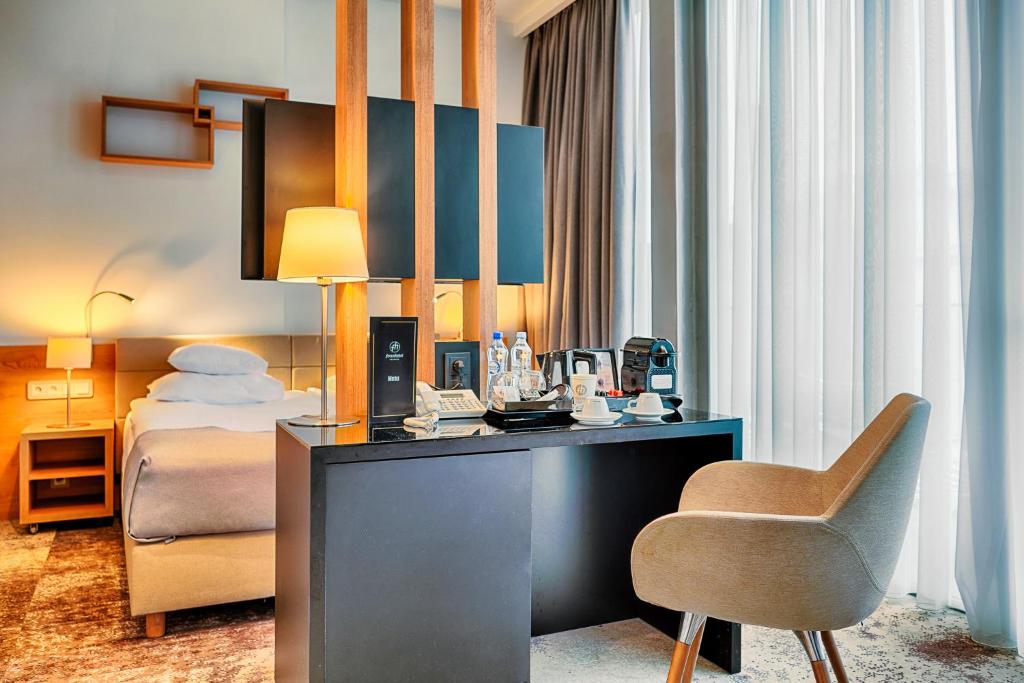 Łóżko lub łóżka w pokoju w obiekcie Focus Hotel Premium Sopot