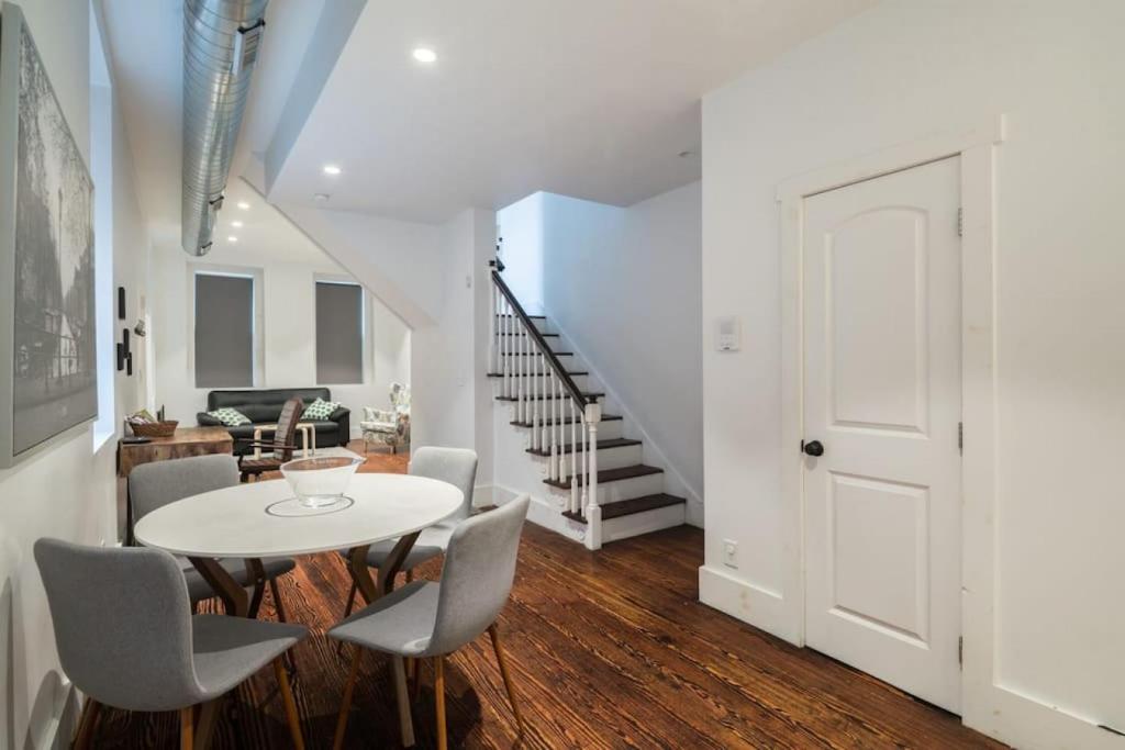 a white dining room with a white table and chairs at Old City Gem 2 BR 1 5 BA,Perfect Location in Philadelphia