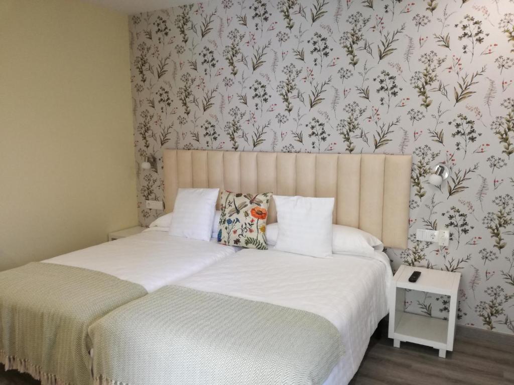 Postel nebo postele na pokoji v ubytování Lar da Mota Boutique Hotel