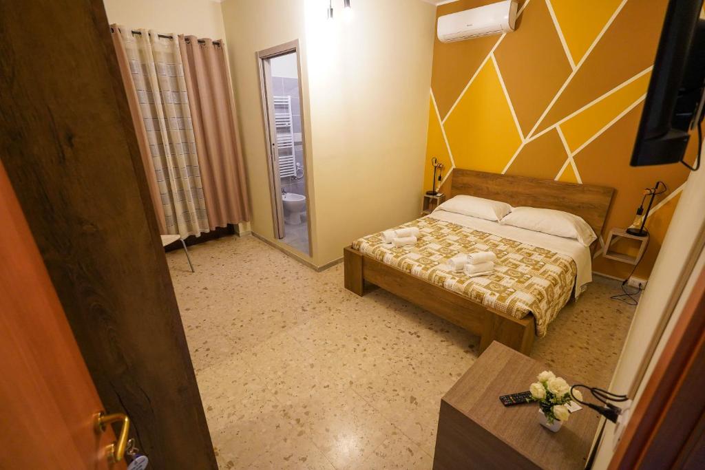 Postel nebo postele na pokoji v ubytování Il Geranio b&b