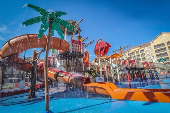 a water park with a water slide in a pool at Westgate Lakes resort in Orlando