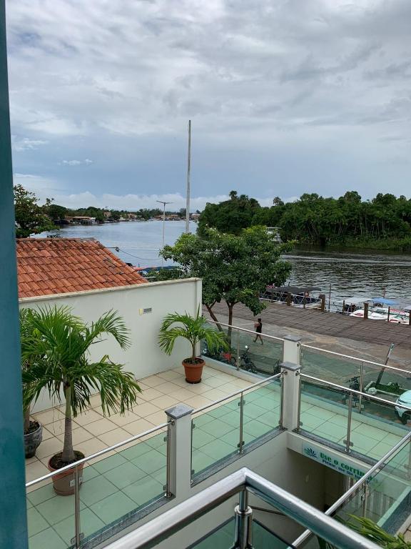 a balcony with a view of a body of water at Pousada Vilas Boas in Barreirinhas