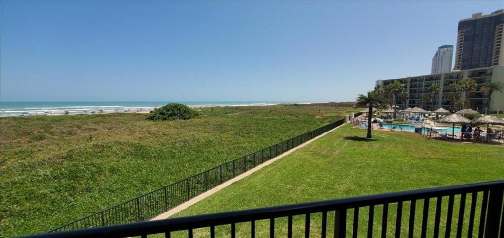 a view of the beach from a balcony of a resort at Saida I Condos S1206 in South Padre Island