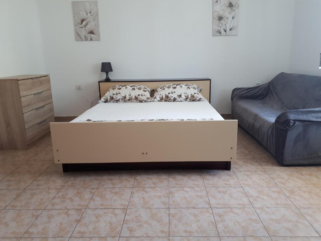 Postel nebo postele na pokoji v ubytování Anic Apartments Stanići