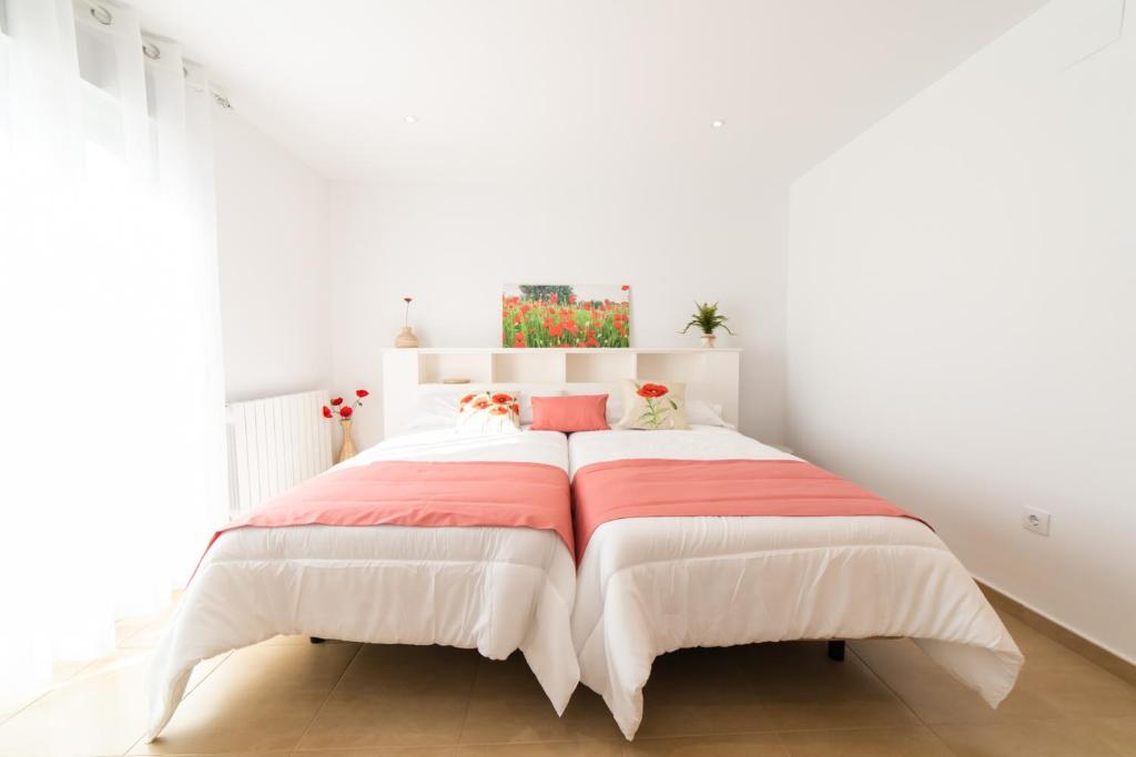 A bed or beds in a room at Apartamentos Turísticos Casa Morocho