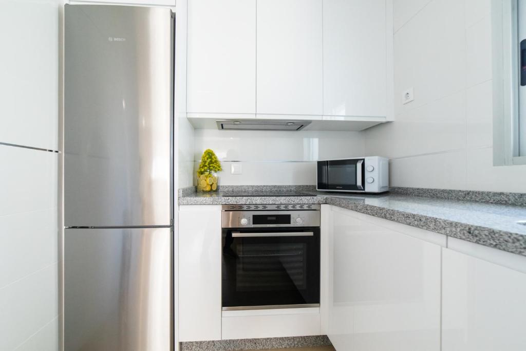 A kitchen or kitchenette at Apartamentos Turísticos Casa Morocho