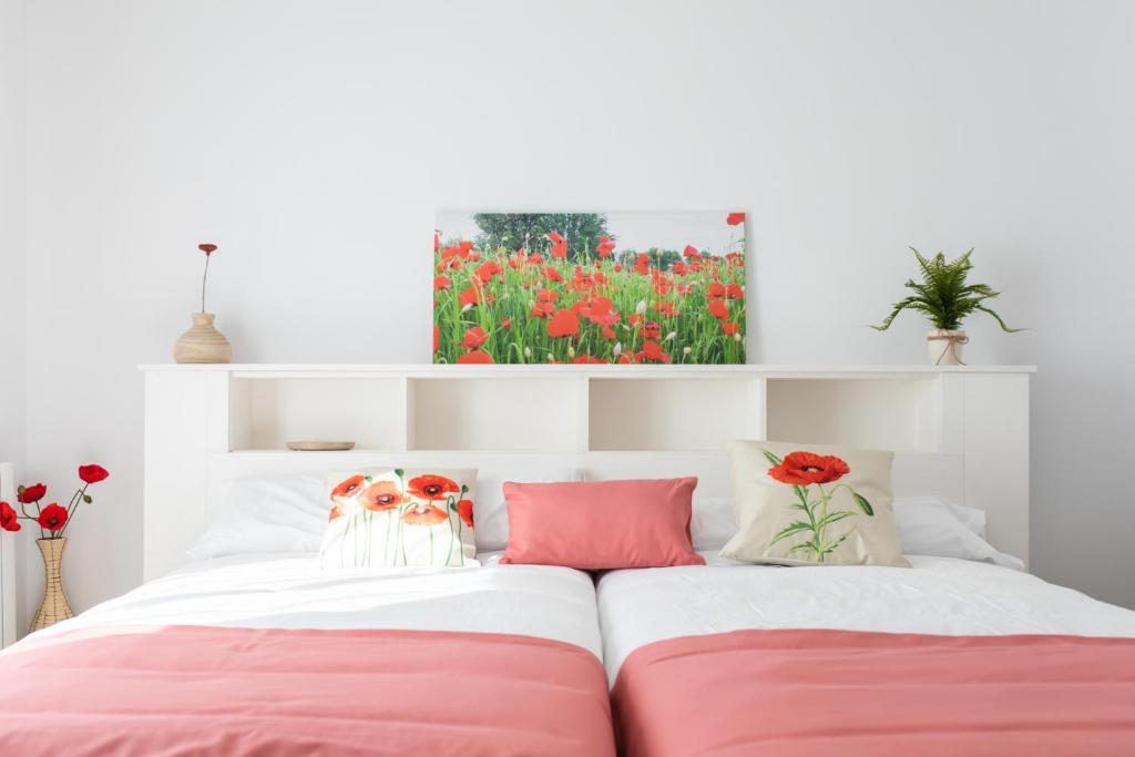 A bed or beds in a room at Apartamentos Turísticos Casa Morocho