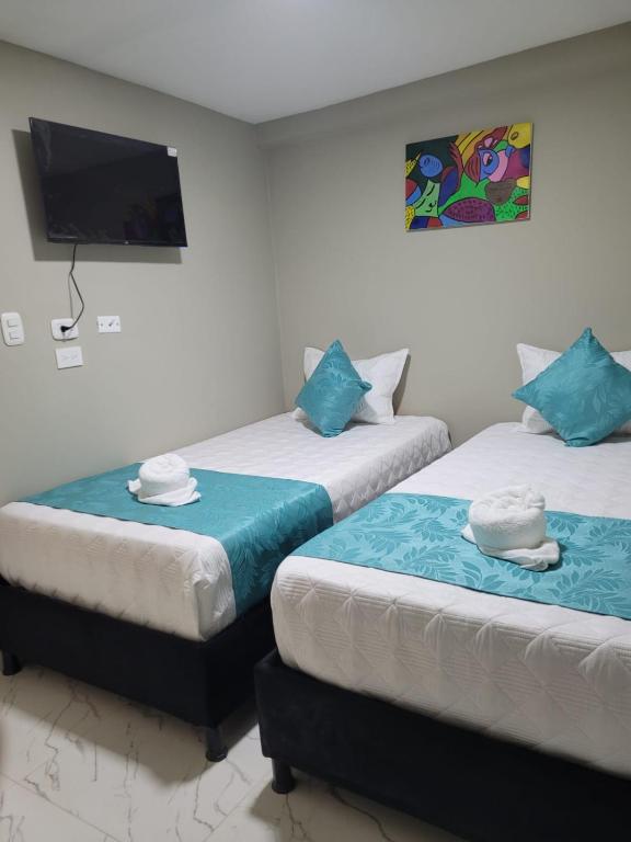 Postel nebo postele na pokoji v ubytování HOTEL LUXEM