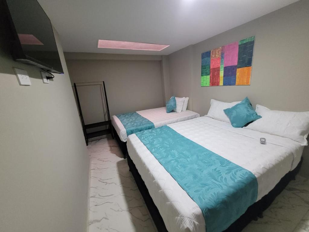 Postel nebo postele na pokoji v ubytování HOTEL LUXEM