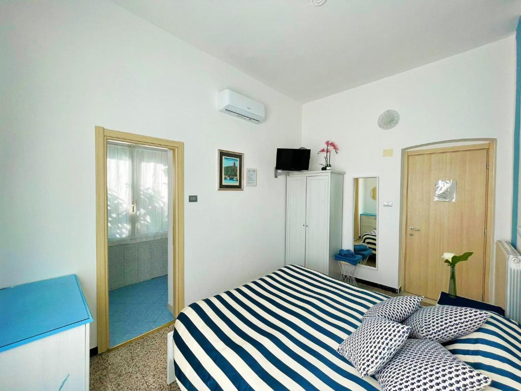Postel nebo postele na pokoji v ubytování Levante Blu