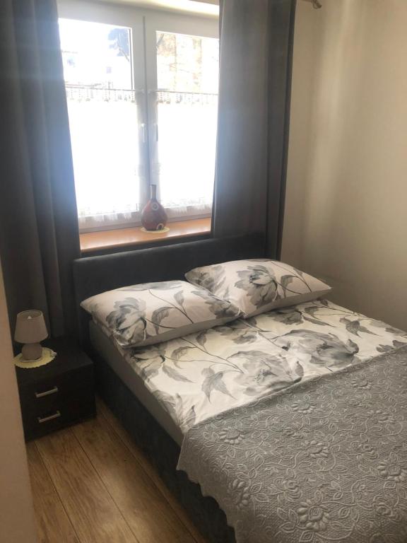 Posteľ alebo postele v izbe v ubytovaní Apartament Stroma 4