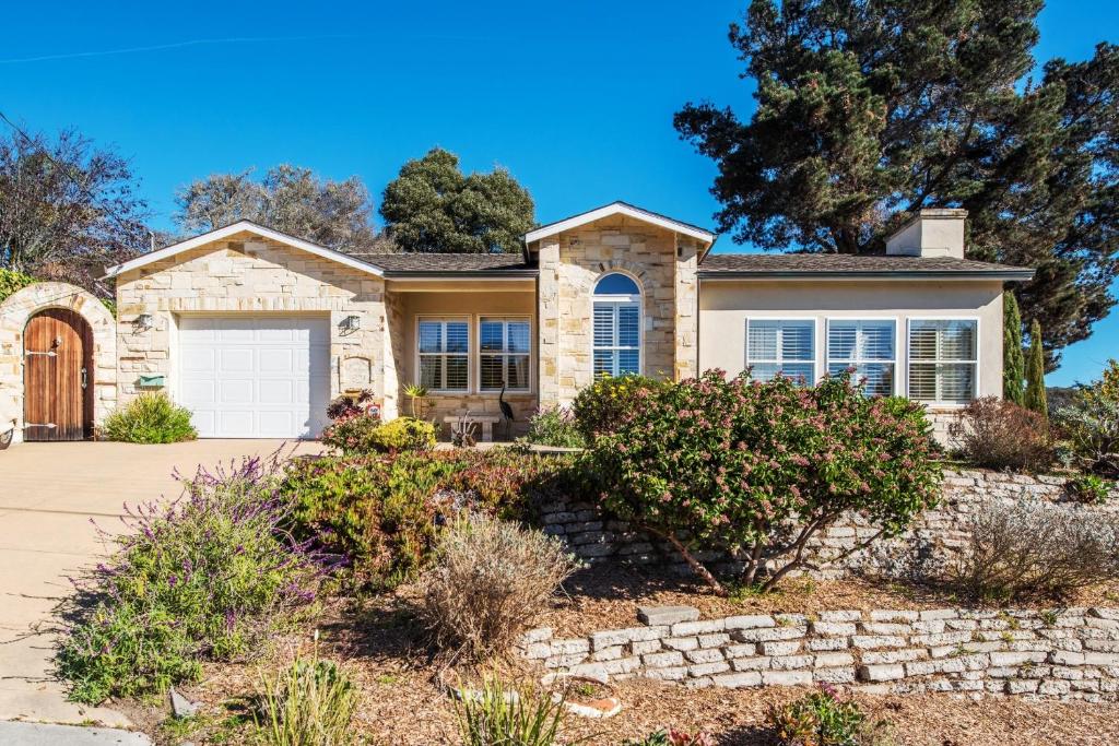 a stone house with a garage at 3485 Avalon by the Sea home in Monterey