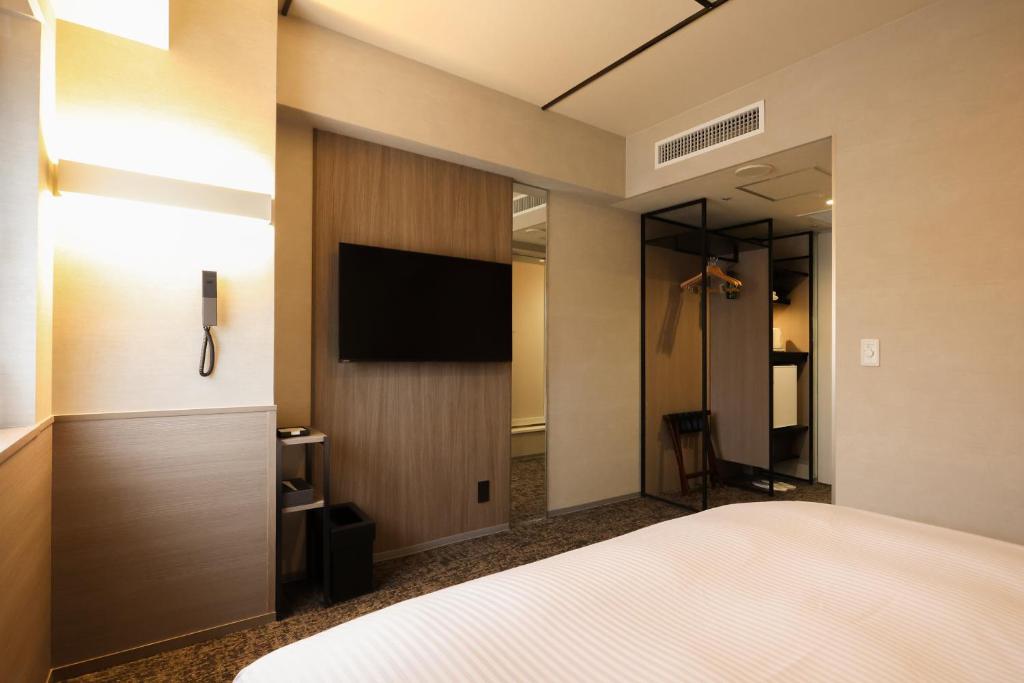 TV a/nebo společenská místnost v ubytování SK HOTEL Kobe Ekimae