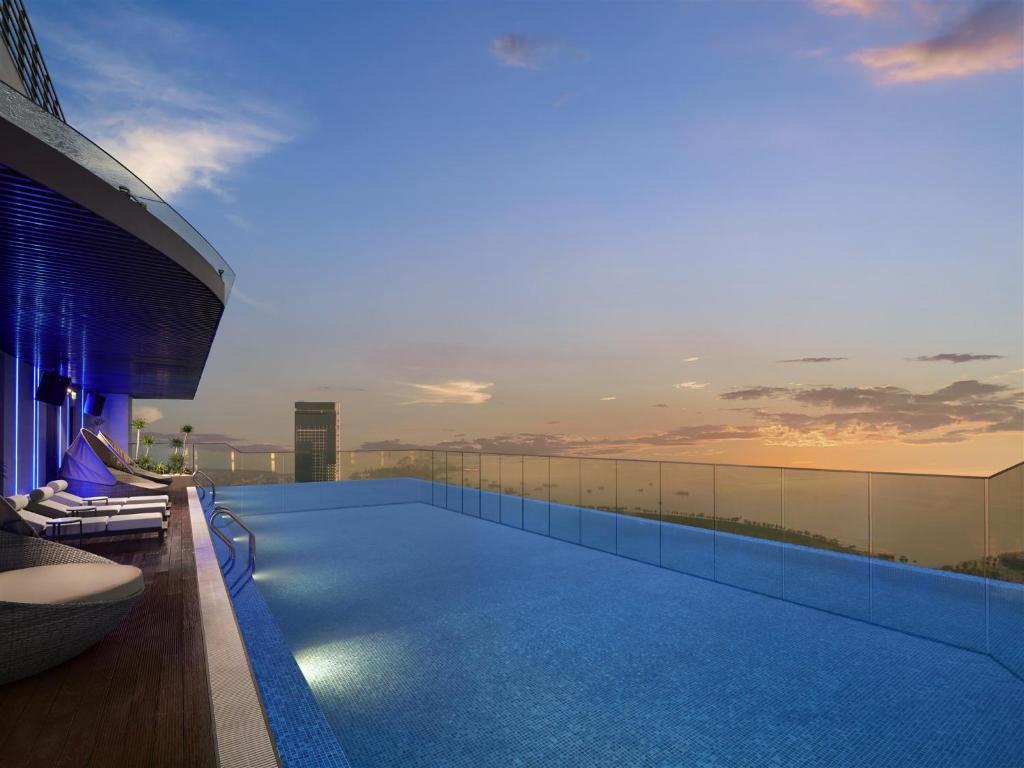 a swimming pool on the roof of a building at The Watson Premium HaLong Hotel in Ha Long