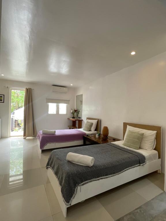Postel nebo postele na pokoji v ubytování Everrich Boutique Resort Boracay