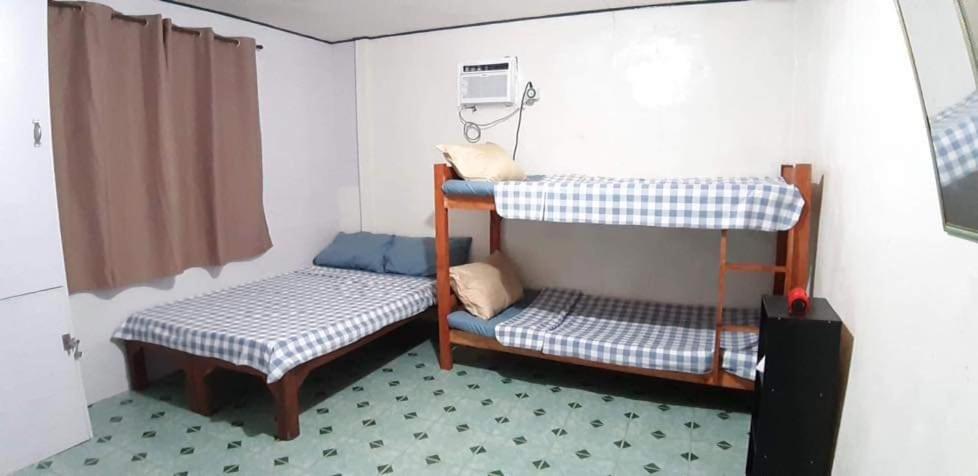Postel nebo postele na pokoji v ubytování Mistow Room CDO
