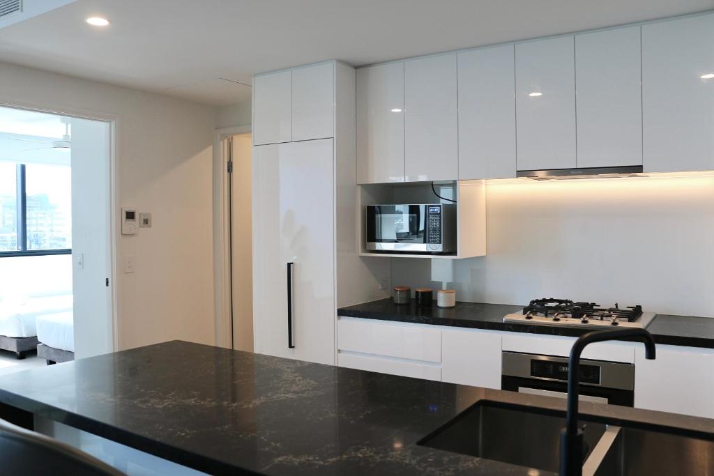 Kuchyň nebo kuchyňský kout v ubytování Kooii Apartments