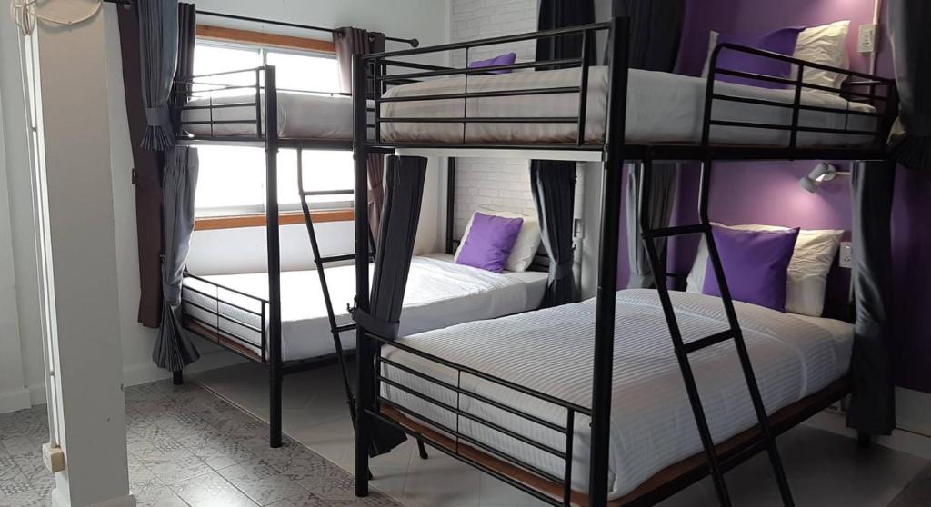 Postel nebo postele na pokoji v ubytování Klai Hat Inn