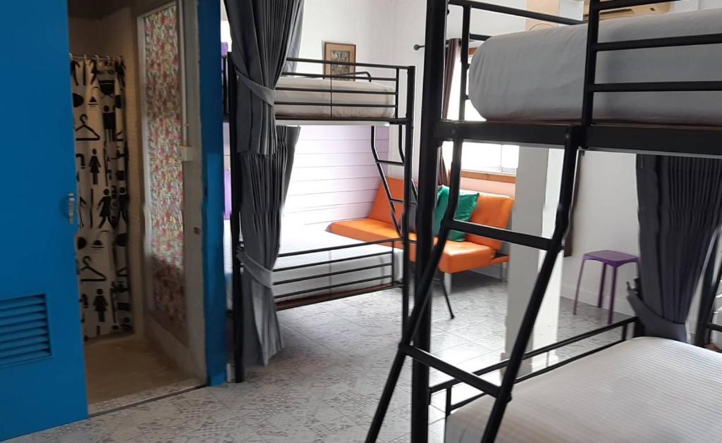 Postel nebo postele na pokoji v ubytování Klai Hat Inn