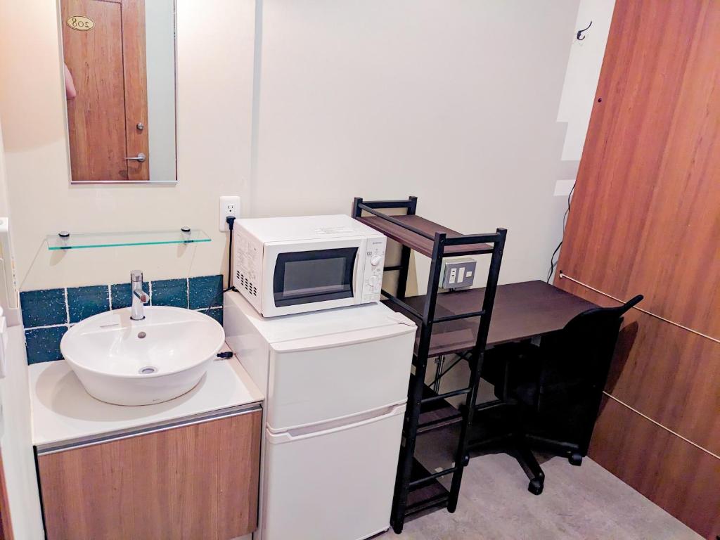 Kuchyň nebo kuchyňský kout v ubytování Hostel JIN
