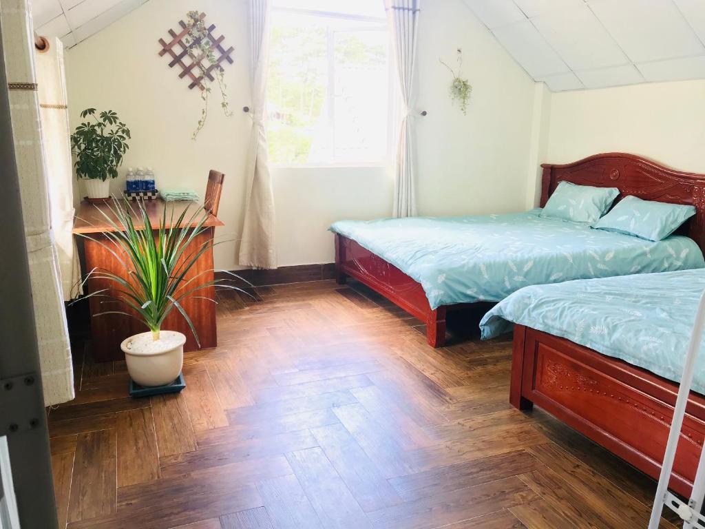Postel nebo postele na pokoji v ubytování NHỚ House V