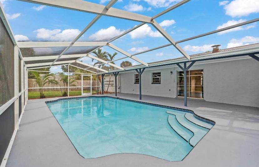 an image of a swimming pool in a house at Pool house near beach in West Melbourne